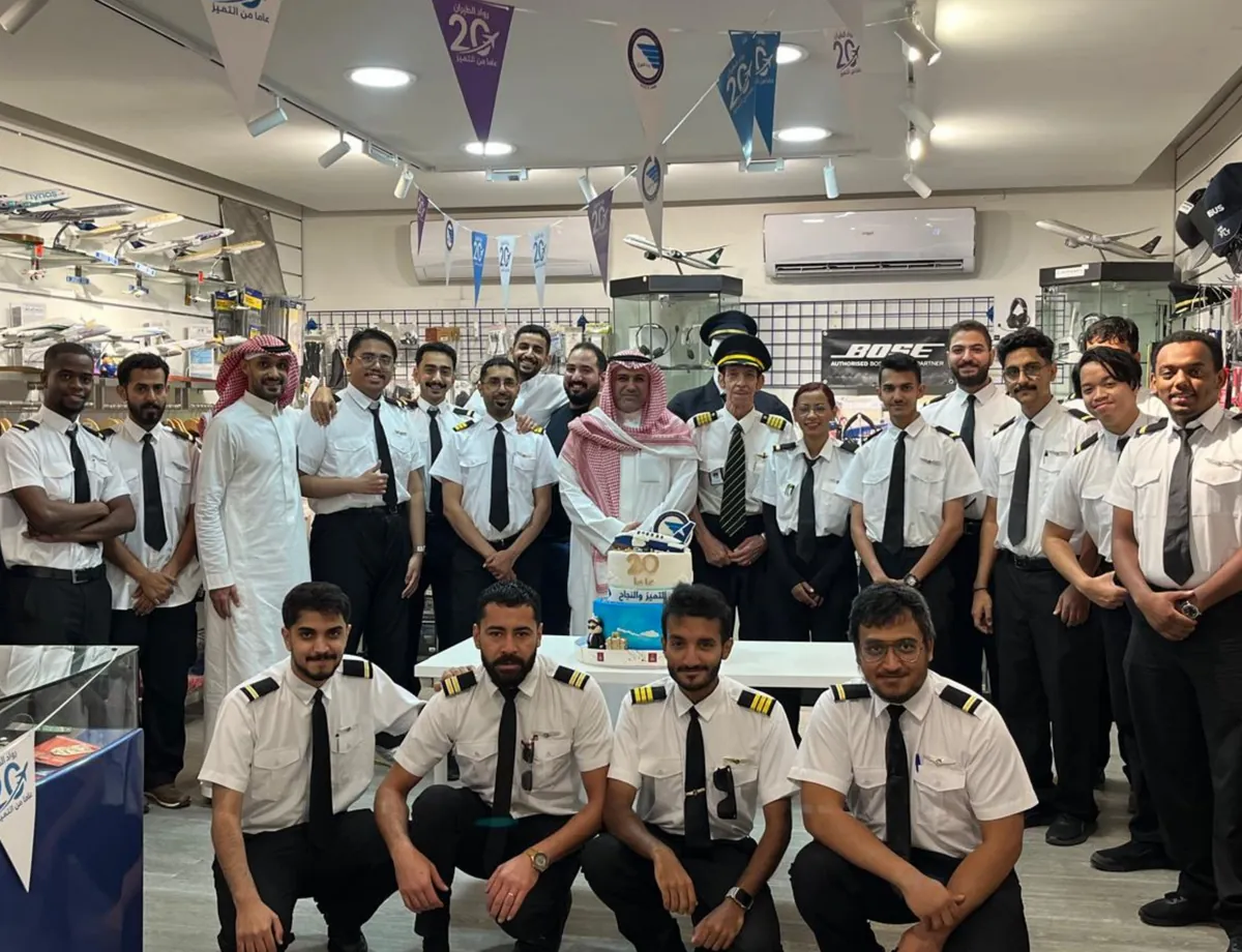 Aviation Pioneers team and students celebrating 20 years in the pilot shop