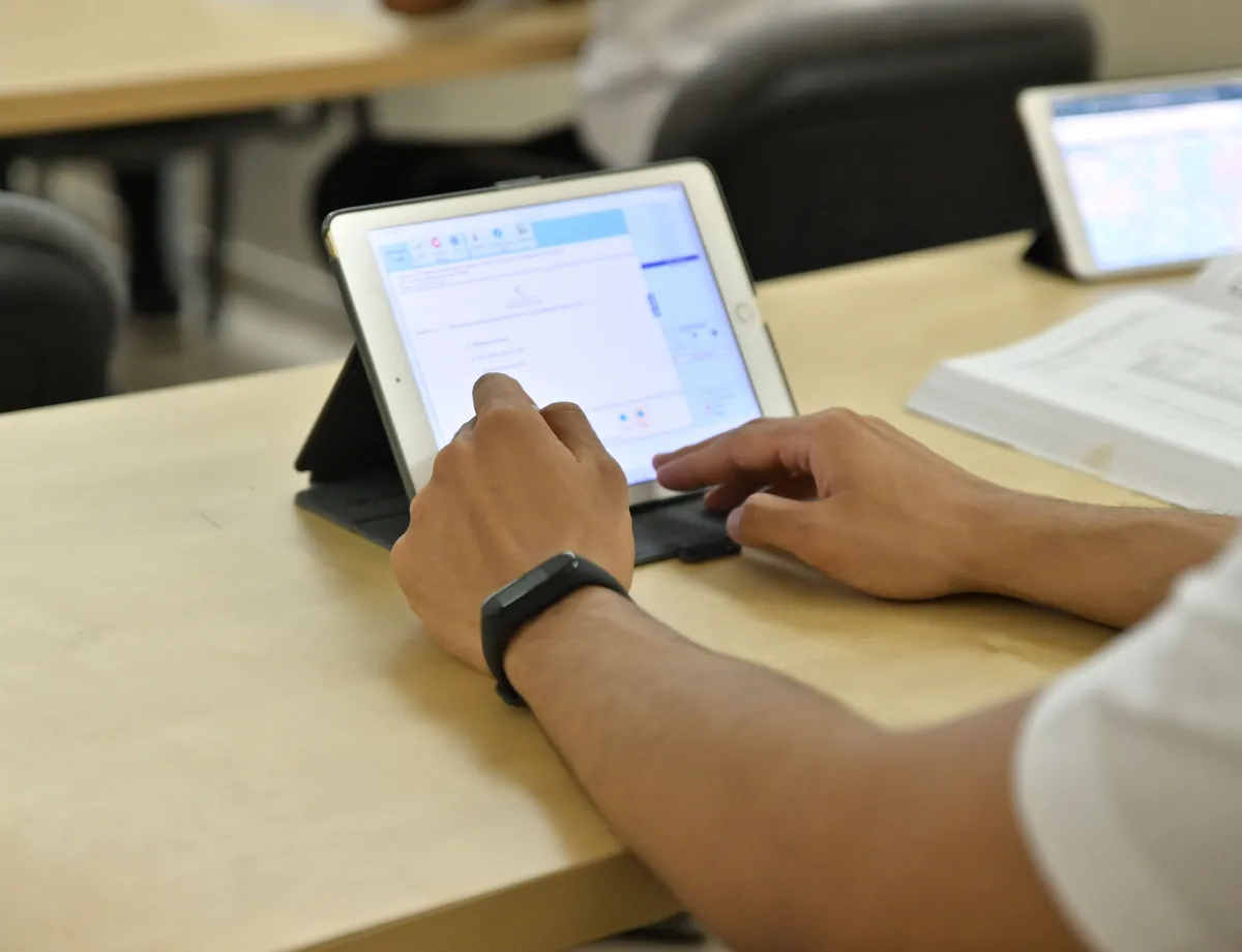 Student working through an aviation English exercise on a tablet